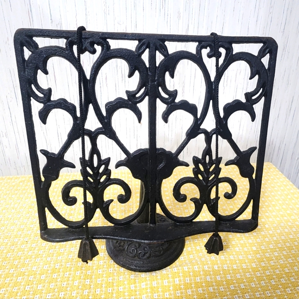 Solid antique cast iron cook book stand.  Approx. 12 inches in height